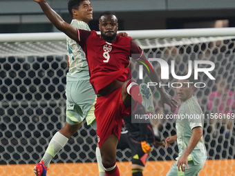 Victor Andres Guzman Olmedo #14 of Mexico and Cyle Larin #9 of Canada battle for the header during the international friendly match between...