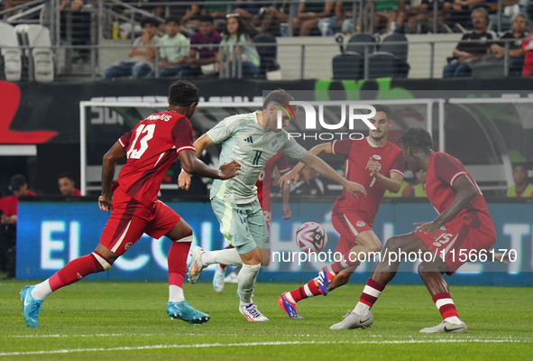 Santiago Gimenez #11 of Mexico drives the ball forward during the international friendly match between Mexico and Canada at AT&T Stadium in...