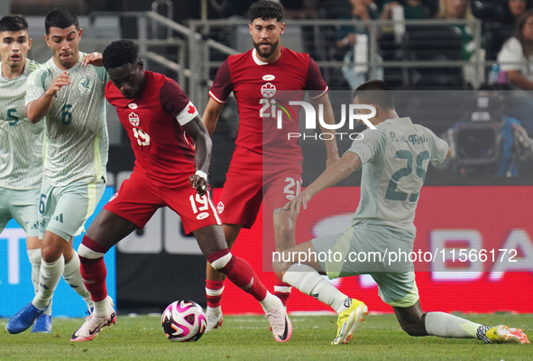 Alphonso Davies #19 of Canada defends the ball during the international friendly match between Mexico and Canada at AT&T Stadium in Mexico C...