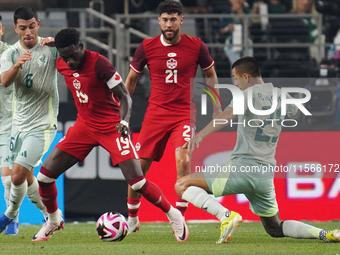 Alphonso Davies #19 of Canada defends the ball during the international friendly match between Mexico and Canada at AT&T Stadium in Mexico C...