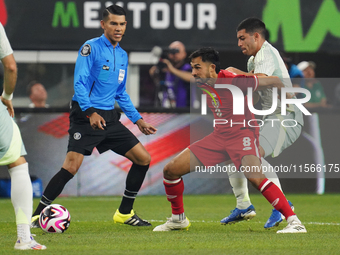 Mathieu Choiniere #8 of Canada battles for the ball during the international friendly match between Mexico and Canada at AT&T Stadium in Mex...