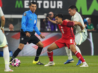 Mathieu Choiniere #8 of Canada battles for the ball during the international friendly match between Mexico and Canada at AT&T Stadium in Mex...