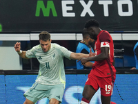 Alphonso Davies #19 of Canada and Santiago Gimenez #11 of Mexico battle for the ball during the international friendly match between Mexico...