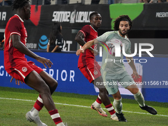 Cesar Huerta #21 of Mexico drives the ball forward during the international friendly match between Mexico and Canada at AT&T Stadium in Mexi...