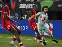 Cesar Huerta #21 of Mexico drives the ball forward during the international friendly match between Mexico and Canada at AT&T Stadium in Mexi...