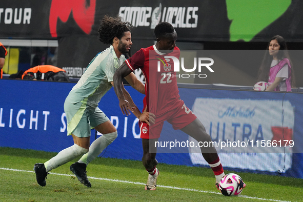 Cesar Huerta #21 of Mexico and Richie Laryea #22 of Canada battle for the ball during the international friendly match between Mexico and Ca...