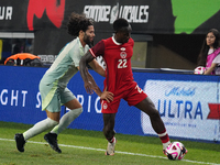 Cesar Huerta #21 of Mexico and Richie Laryea #22 of Canada battle for the ball during the international friendly match between Mexico and Ca...