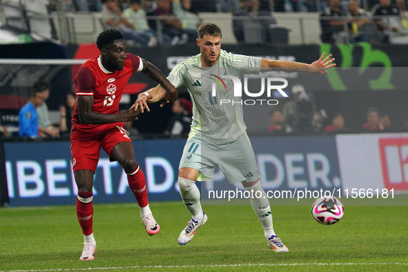 Alphonso Davies #19 of Canada and Santiago Gimenez #11 of Mexico battle for the ball during the international friendly match between Mexico...