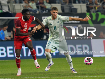 Alphonso Davies #19 of Canada and Santiago Gimenez #11 of Mexico battle for the ball during the international friendly match between Mexico...