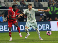 Alphonso Davies #19 of Canada and Santiago Gimenez #11 of Mexico battle for the ball during the international friendly match between Mexico...