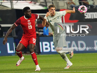 Alphonso Davies #19 of Canada and Santiago Gimenez #11 of Mexico battle for the ball during the international friendly match between Mexico...