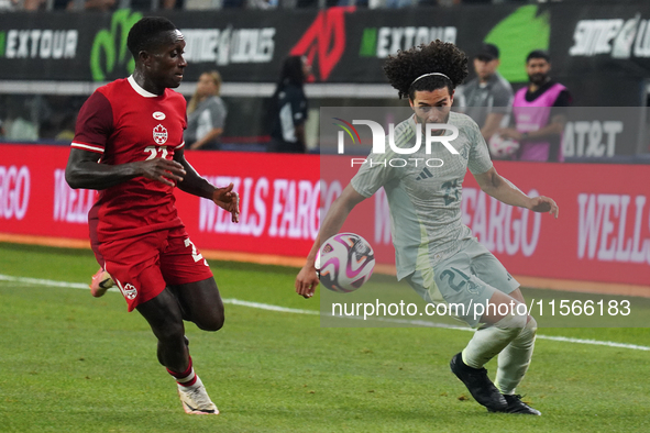 Cesar Huerta #21 of Mexico and Richie Laryea #22 of Canada battle for the ball during the international friendly match between Mexico and Ca...