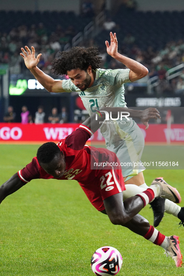 Cesar Huerta #21 of Mexico and Richie Laryea #22 of Canada battle for the ball during the international friendly match between Mexico and Ca...