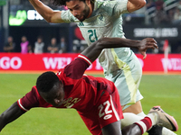 Cesar Huerta #21 of Mexico and Richie Laryea #22 of Canada battle for the ball during the international friendly match between Mexico and Ca...