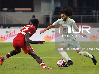 Cesar Huerta #21 of Mexico drives the ball forward during the international friendly match between Mexico and Canada at AT&T Stadium in Mexi...