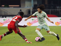 Cesar Huerta #21 of Mexico drives the ball forward during the international friendly match between Mexico and Canada at AT&T Stadium in Mexi...