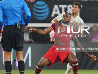 Cyle Larin #9 of Canada battles for the ball during the international friendly match between Mexico and Canada at AT&T Stadium in Mexico Cit...