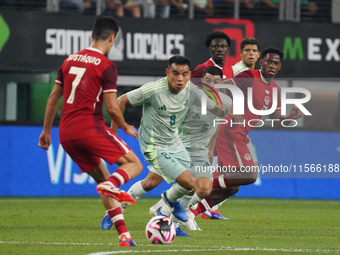 Carlos Rodriguez #8 of Mexico drives the ball forward during the international friendly match between Mexico and Canada at AT&T Stadium in M...