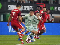 Carlos Rodriguez #8 of Mexico drives the ball forward during the international friendly match between Mexico and Canada at AT&T Stadium in M...