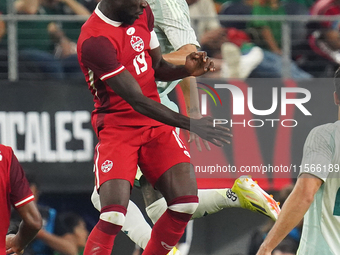 Alphonso Davies #19 of Canada jumps for the header during the international friendly match between Mexico and Canada at AT&T Stadium in Mexi...