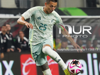 Roberto Alvarado #25 of Mexico controls the ball during the international friendly match between Mexico and Canada at AT&T Stadium in Mexico...