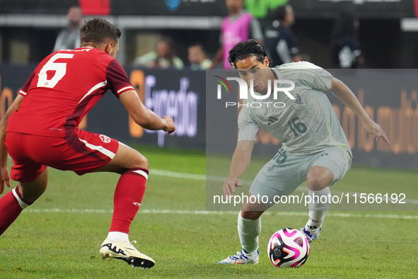 Diego Lainez #16 of Mexico drives the ball forward during the international friendly match between Mexico and Canada at AT&T Stadium in Mexi...