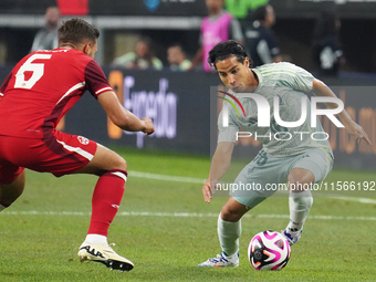 Diego Lainez #16 of Mexico drives the ball forward during the international friendly match between Mexico and Canada at AT&T Stadium in Mexi...