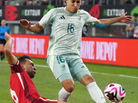 Diego Lainez #16 of Mexico drives the ball forward during the international friendly match between Mexico and Canada at AT&T Stadium in Mexi...