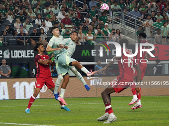 Luis Romo #7 of Mexico heads the ball during the international friendly match between Mexico and Canada at AT&T Stadium in Mexico City, Mexi...