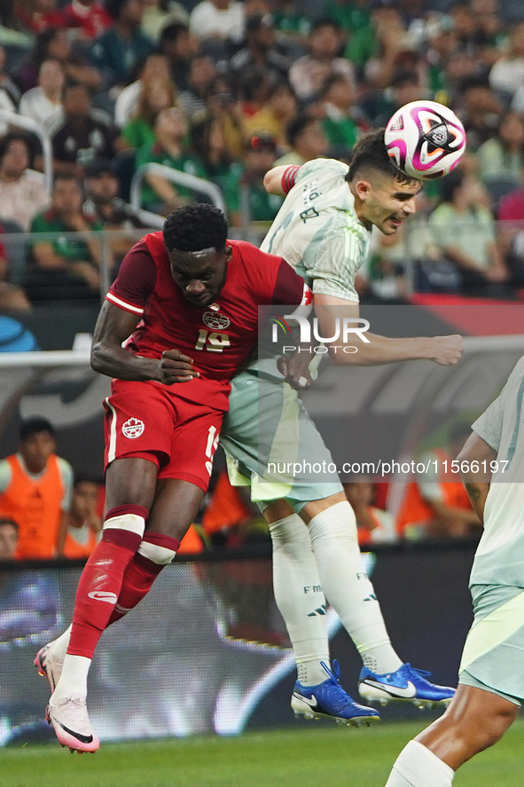 Alphonso Davies #19 of Canada and Johan Vasquez #5 of Mexico battle for the header during the international friendly match between Mexico an...