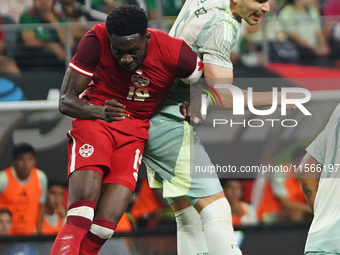 Alphonso Davies #19 of Canada and Johan Vasquez #5 of Mexico battle for the header during the international friendly match between Mexico an...