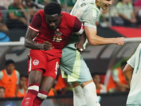 Alphonso Davies #19 of Canada and Johan Vasquez #5 of Mexico battle for the header during the international friendly match between Mexico an...