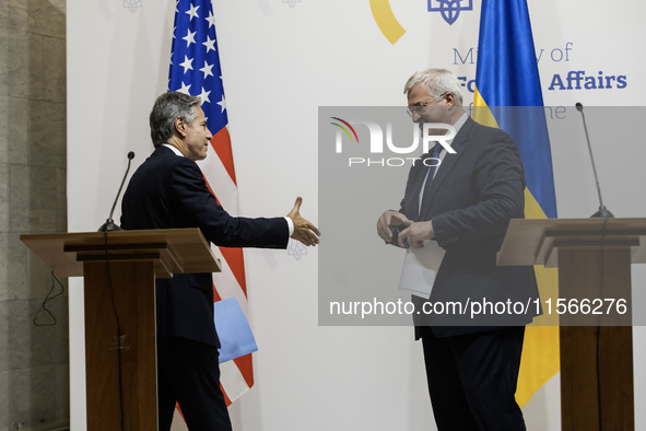 U.S. Secretary of State Antony Blinken greets Ukraine's Foreign Minister Andrii Sybiha at a joint press conference with Britain's Foreign Se...