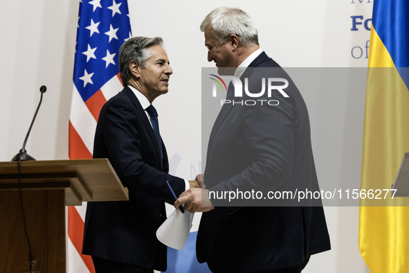 U.S. Secretary of State Antony Blinken greets Ukraine's Foreign Minister Andrii Sybiha at a joint press conference with Britain's Foreign Se...