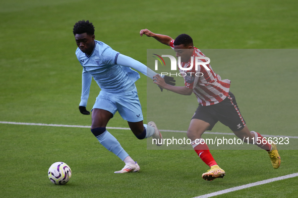 Elijah Izobodo of Athletic Club Bilbao challenges Jewison Bennette of Sunderland during the Premier League International Cup Group B match b...