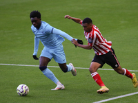 Elijah Izobodo of Athletic Club Bilbao challenges Jewison Bennette of Sunderland during the Premier League International Cup Group B match b...