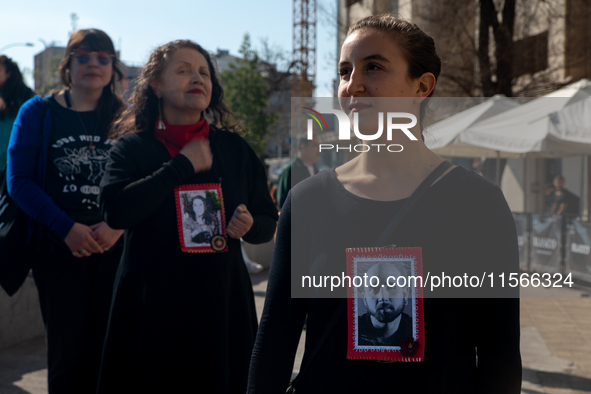 Members of the Cueca Sola collective perform an activity in front of the Palacio de La Moneda to commemorate the 51st anniversary of the Mil...