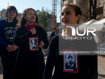 Members of the Cueca Sola collective perform an activity in front of the Palacio de La Moneda to commemorate the 51st anniversary of the Mil...