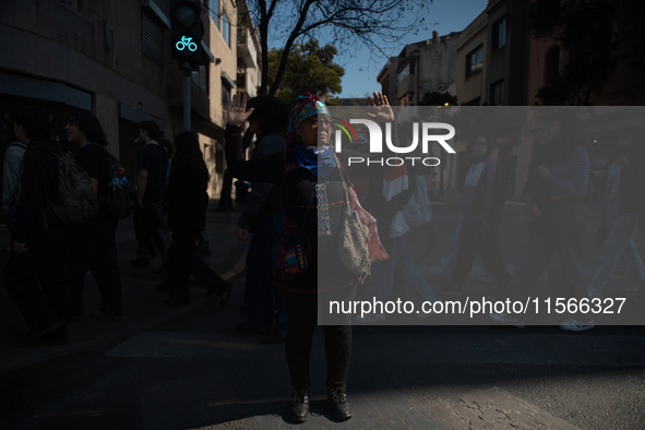 Members of the Cueca Sola collective perform an activity in front of the Palacio de La Moneda to commemorate the 51st anniversary of the Mil...