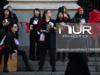 Members of the Cueca Sola collective perform an activity in front of the Palacio de La Moneda to commemorate the 51st anniversary of the Mil...