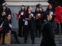 Members of the Cueca Sola collective perform an activity in front of the Palacio de La Moneda to commemorate the 51st anniversary of the Mil...