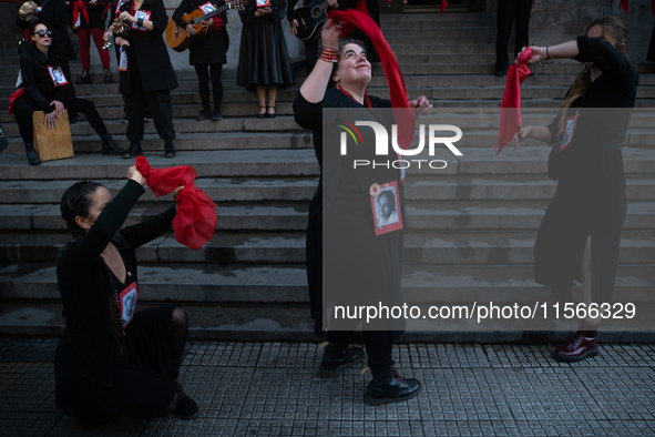 Members of the Cueca Sola collective perform an activity in front of the Palacio de La Moneda to commemorate the 51st anniversary of the Mil...