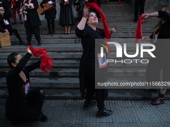 Members of the Cueca Sola collective perform an activity in front of the Palacio de La Moneda to commemorate the 51st anniversary of the Mil...