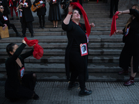 Members of the Cueca Sola collective perform an activity in front of the Palacio de La Moneda to commemorate the 51st anniversary of the Mil...