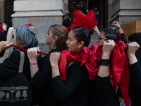 Members of the Cueca Sola collective perform an activity in front of the Palacio de La Moneda to commemorate the 51st anniversary of the Mil...