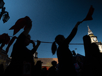 Members of the Cueca Sola collective perform an activity in front of the Palacio de La Moneda to commemorate the 51st anniversary of the Mil...