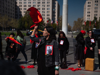 Members of the Cueca Sola collective perform an activity in front of the Palacio de La Moneda to commemorate the 51st anniversary of the Mil...