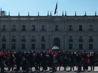 Members of the Cueca Sola collective perform an activity in front of the Palacio de La Moneda to commemorate the 51st anniversary of the Mil...