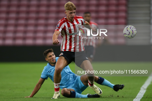 David Osipov of Athletic Club Bilbao tackles Tom Watson of Sunderland during the Premier League International Cup Group B match between Sund...