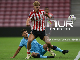 David Osipov of Athletic Club Bilbao tackles Tom Watson of Sunderland during the Premier League International Cup Group B match between Sund...